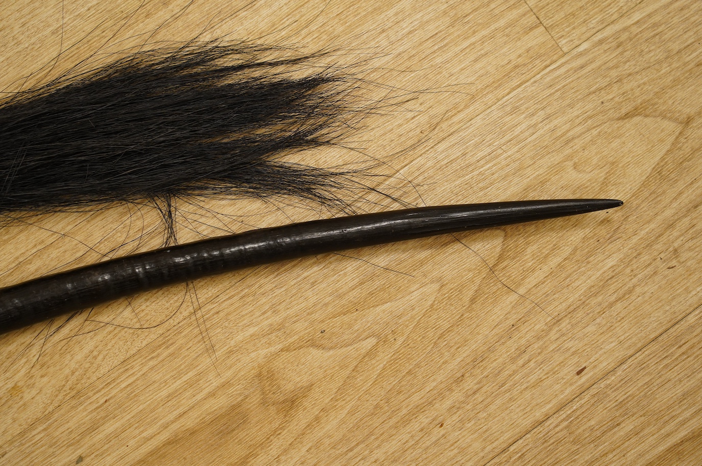 An African antelope horn, 92cm long, and a fly whisk. Condition - fair to good